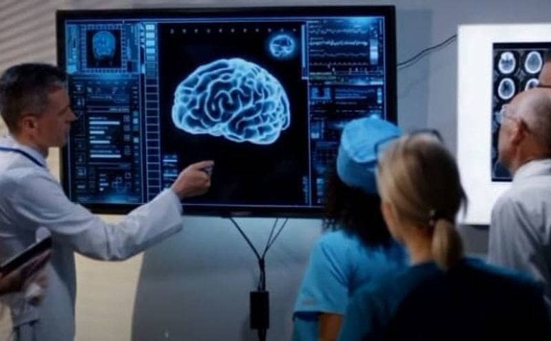 Doctors looking at a brain scan 
