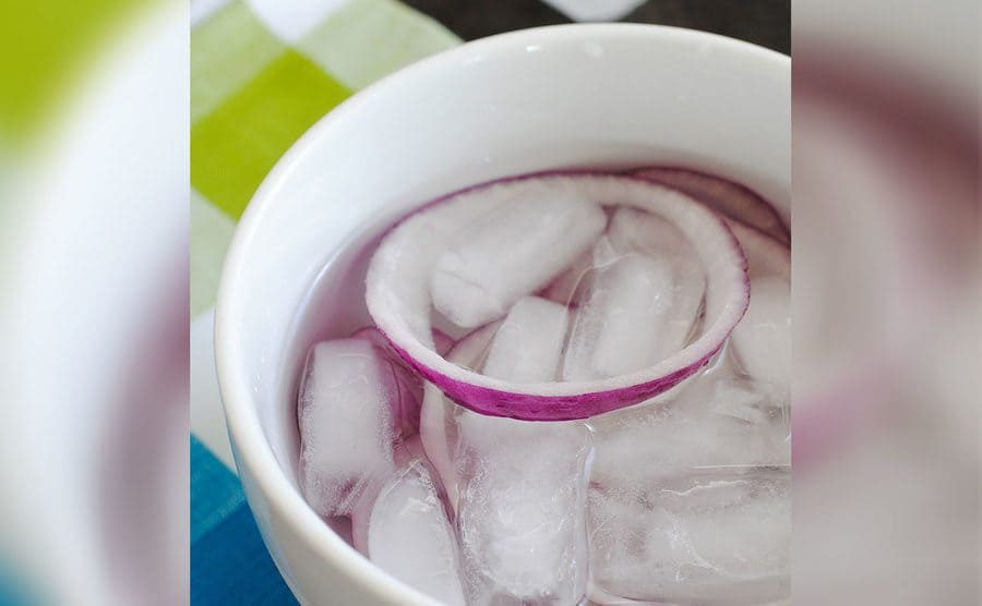 Red onions soaking in ice water