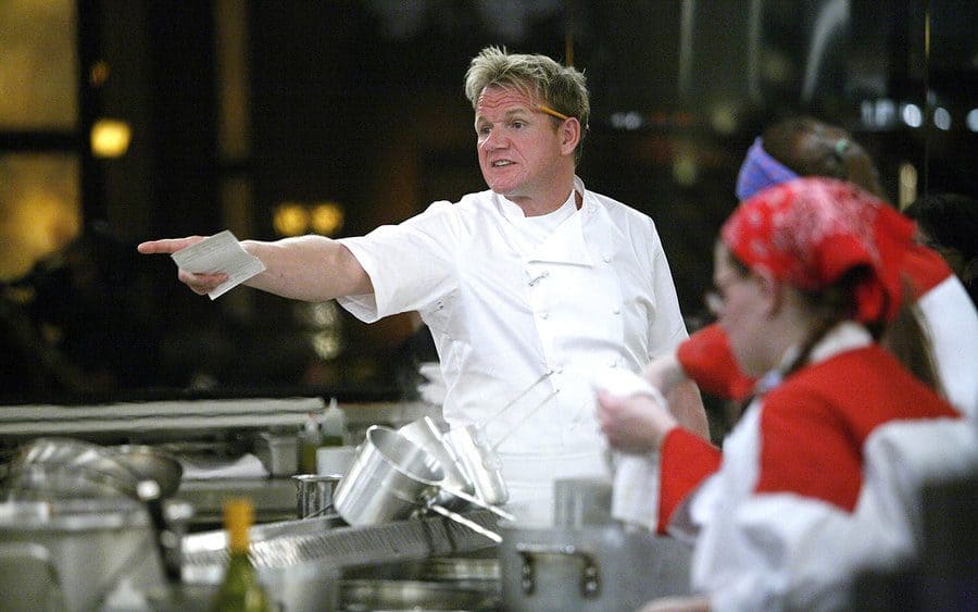 Gordon Ramsay pointing towards the kitchen in ‘Hell’s Kitchen.’ 