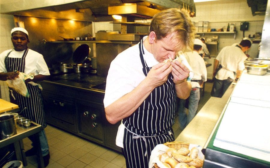 Gordon Ramsay sniffing bread in his kitchen in 1999 