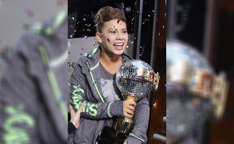 Bindi Irwin holding the Mirror ball trophy after winning Dancing with The Stars season 21