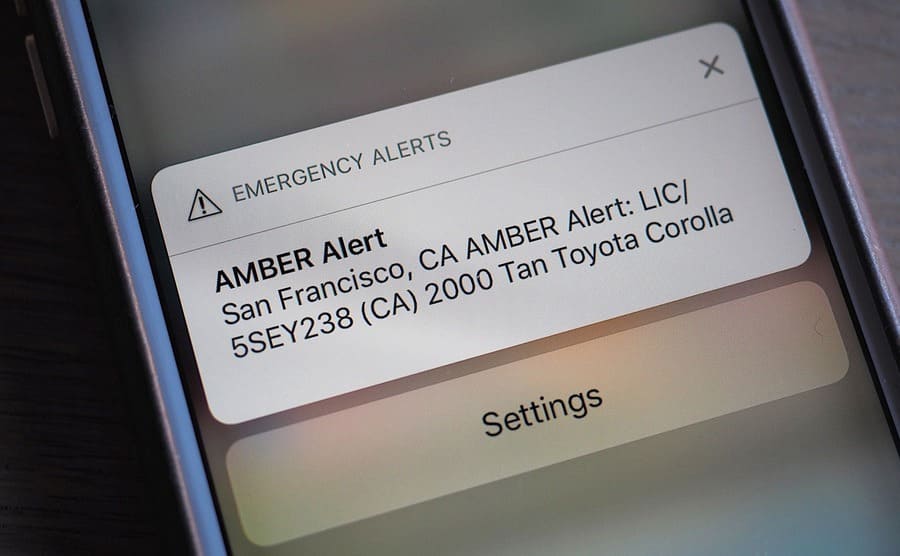 An Amber Alert emergency alert on a smart phone to look out for a 2000 Tan Toyota Corolla in San Francisco 