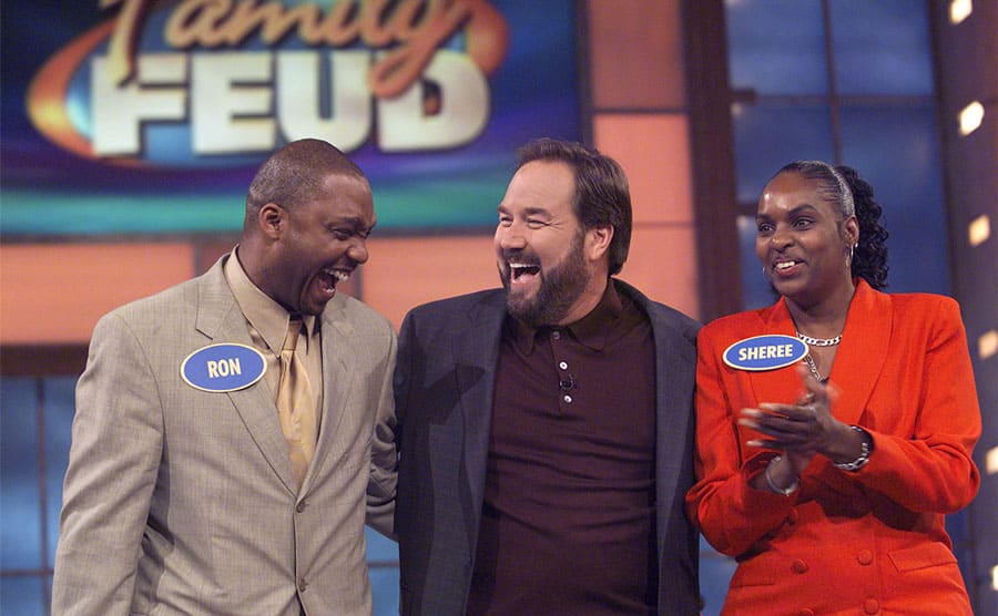 Richard Karn with two contestants on Family Feud, Ron and Sheree