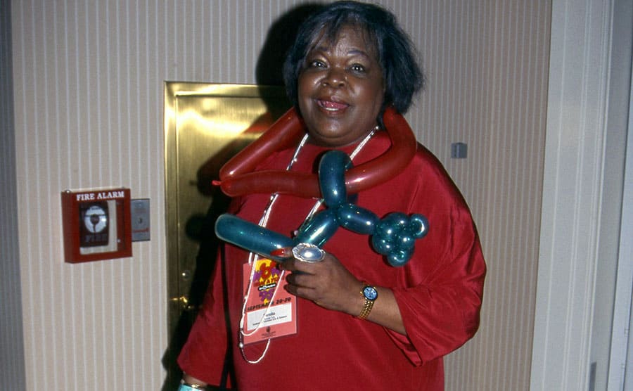 Oprah’s mother standing in a hallway with balloon animals 