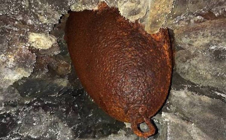 The undetonated bomb stuck in dried up lava