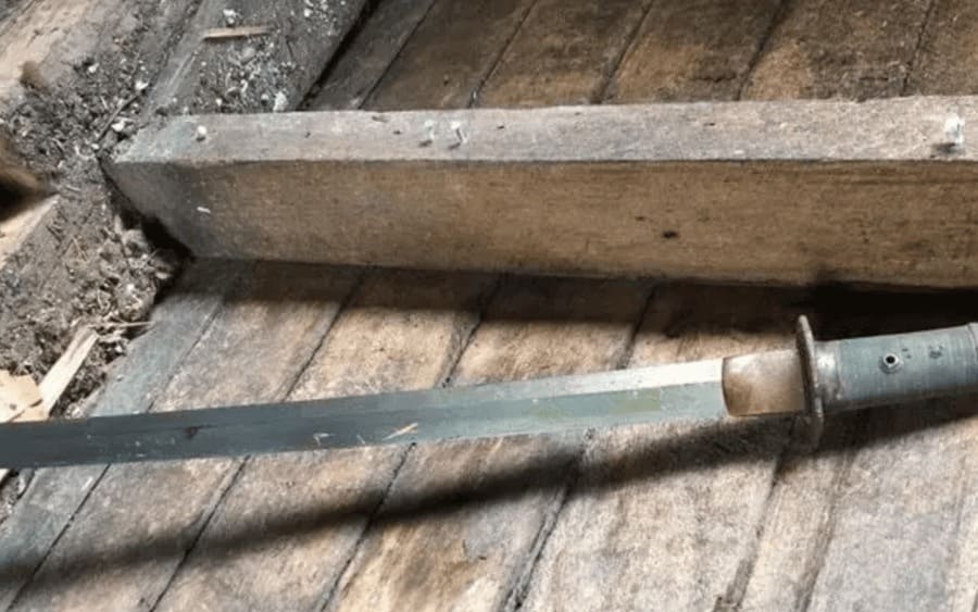an old sword hidden in the wall