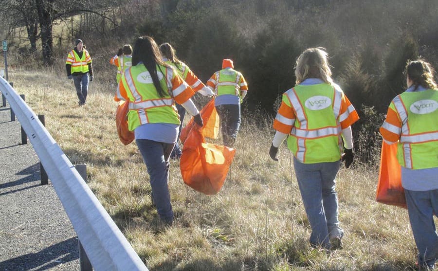 People doing community service roadside clean up 