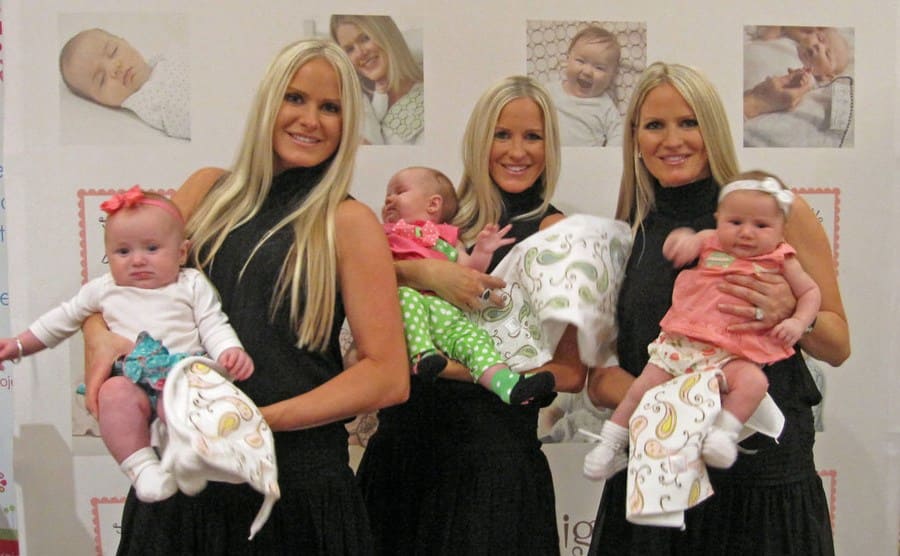 The triplets holding their babies, Nicole Dahm, Erica Dahm, Jaclyn Dahm 