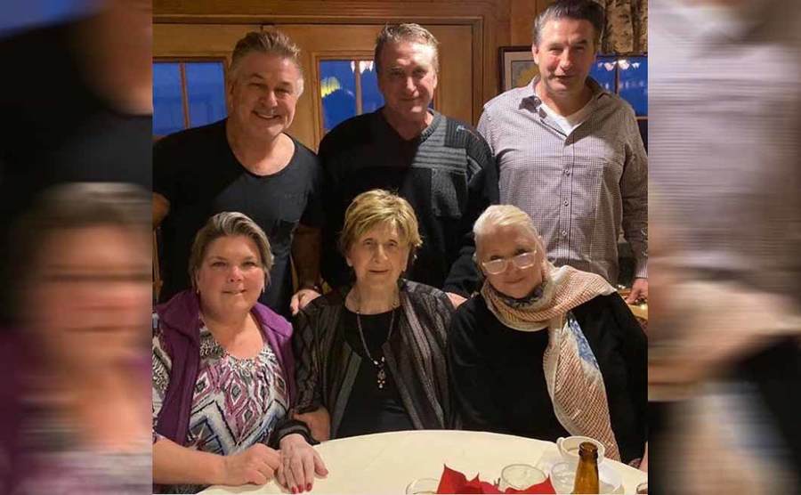 Alec, Stephen, and Billy posing with their mother and two other women on her birthday