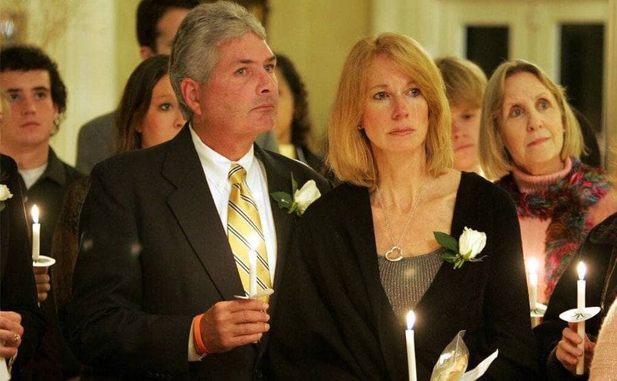 Beth Holloway and her husband George “Jug” Twitty during a prayer holding candles