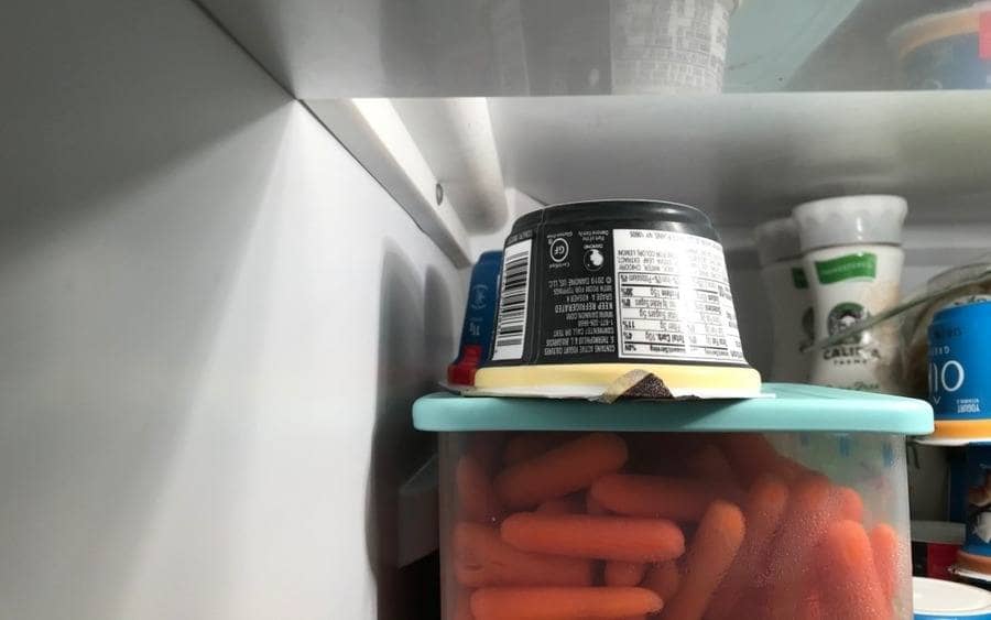 A yogurt stored in the refrigerator stored upside down
