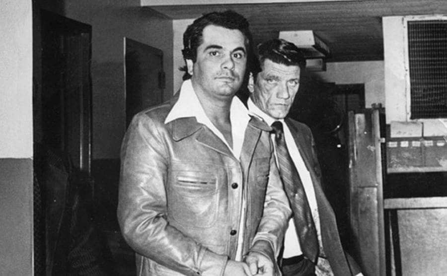 John Gotti as a young man walking next to another person