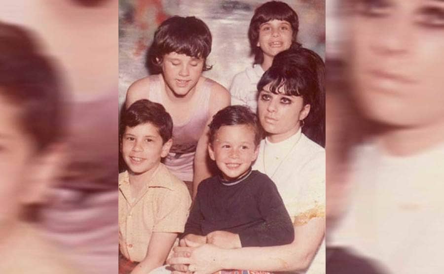 John Gotti’s daughters Angel and Victoria, sitting behind his wife, Victoria, and sons Frankie Boy and John