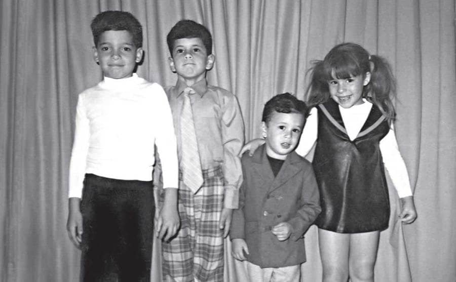 John Junior and his brother Frankie palling around with John and Anna Maria Ruggiero 