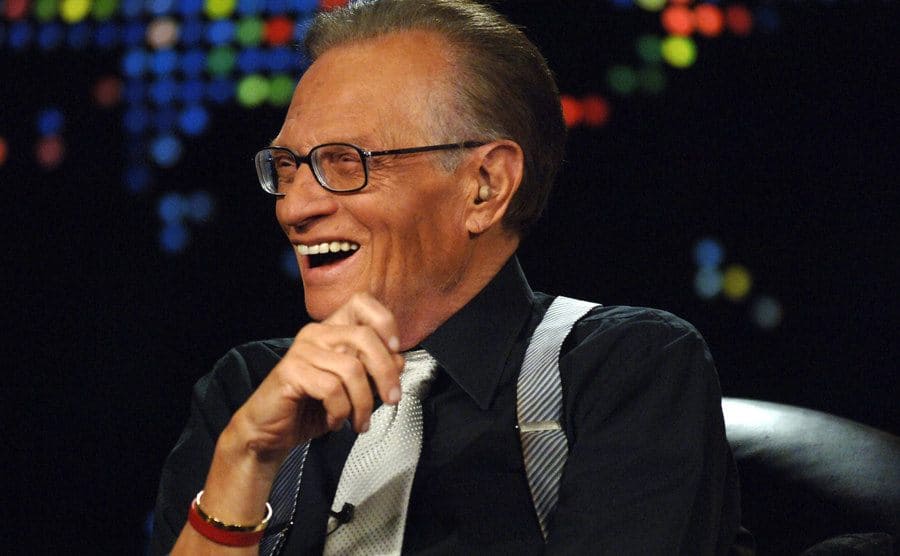 Larry King laughing during his toast to 50 years in the broadcast. 
