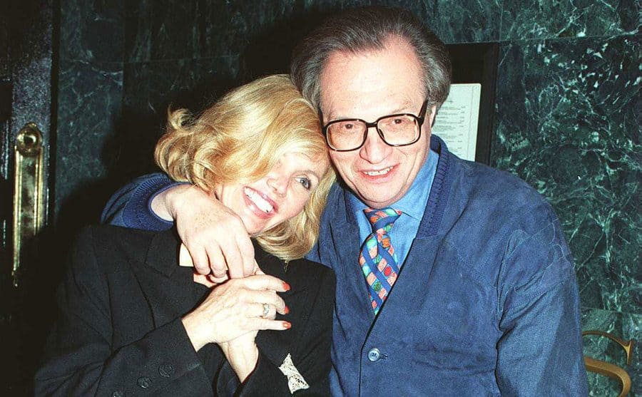 Larry King with his arm around Deanna Lund recently after their engagement 