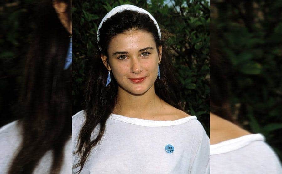 Demi Moore posing for a portrait when she was younger 