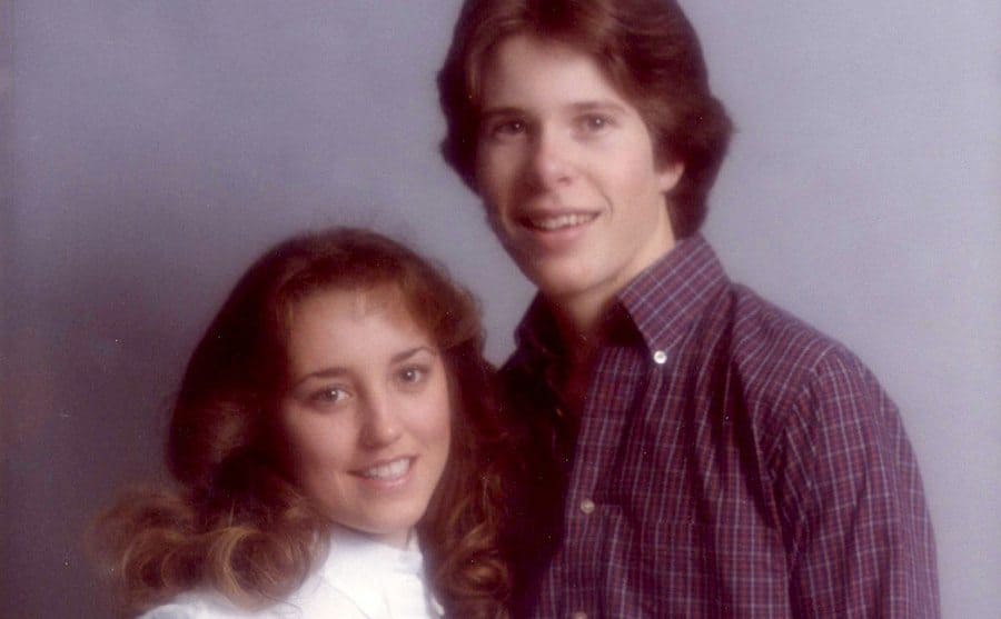 young Jim Bob and Michelle Duggar posing for a studio photo.