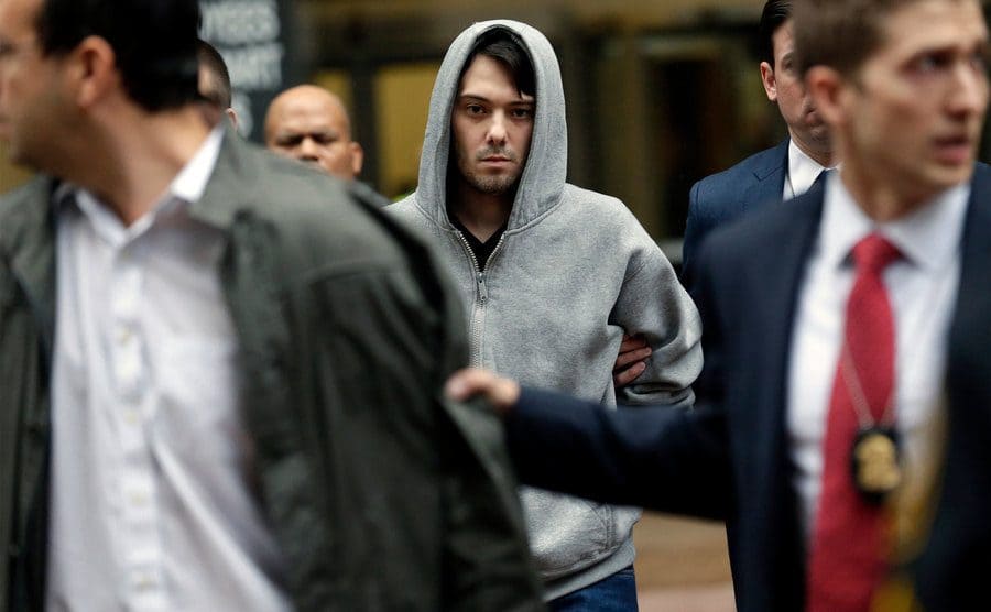 Shkreli getting perp walked out of court.