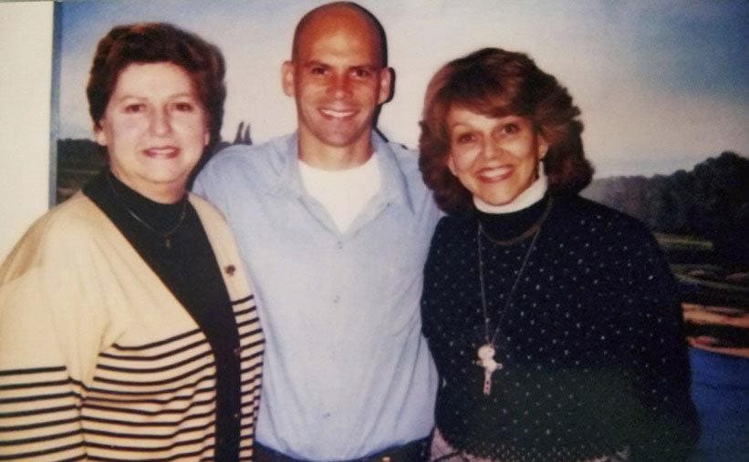 Terry Baralt, Lyle Menendez, and Marta Cano posing together in prison in 2003