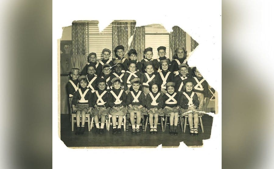 A class photo of Stephanie as a young girl showing that she is the only African American girl in the class. 