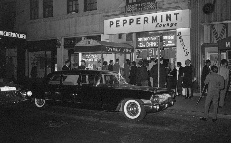 Patrons and limousines line up in front of the Peppermint Lounge.