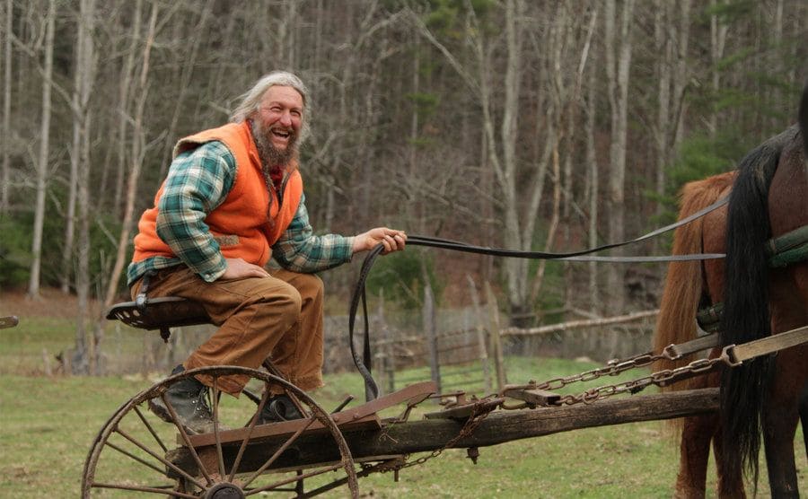 Eustace Conway working his land on the back of his horses. He looks pretty happy. 