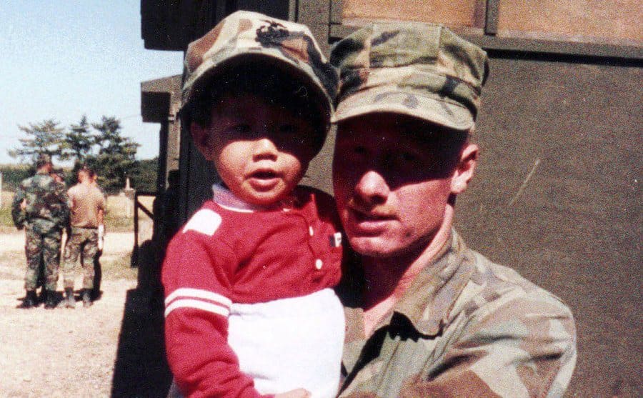 A photo of David in his military uniform on base being visited by family. 