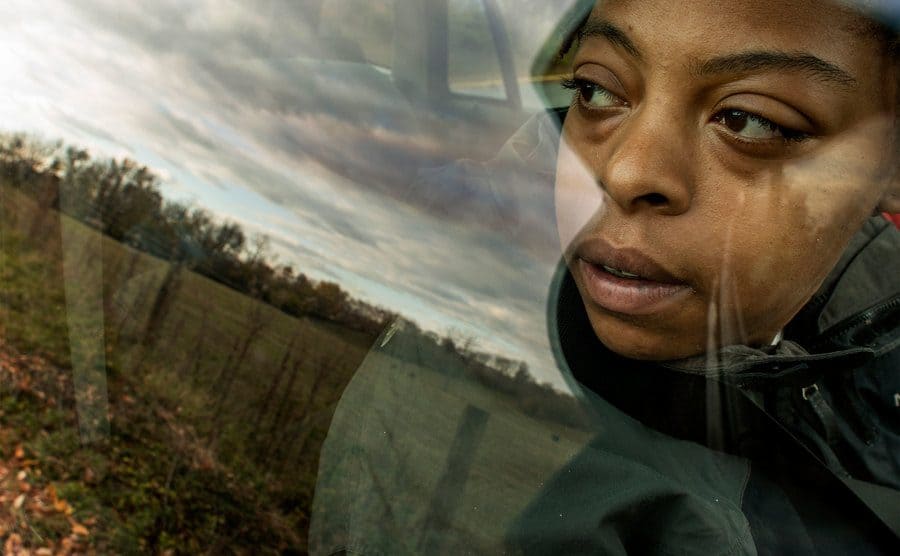 Shamika Young views a field across from Grafton School in Winchester through a car window. 