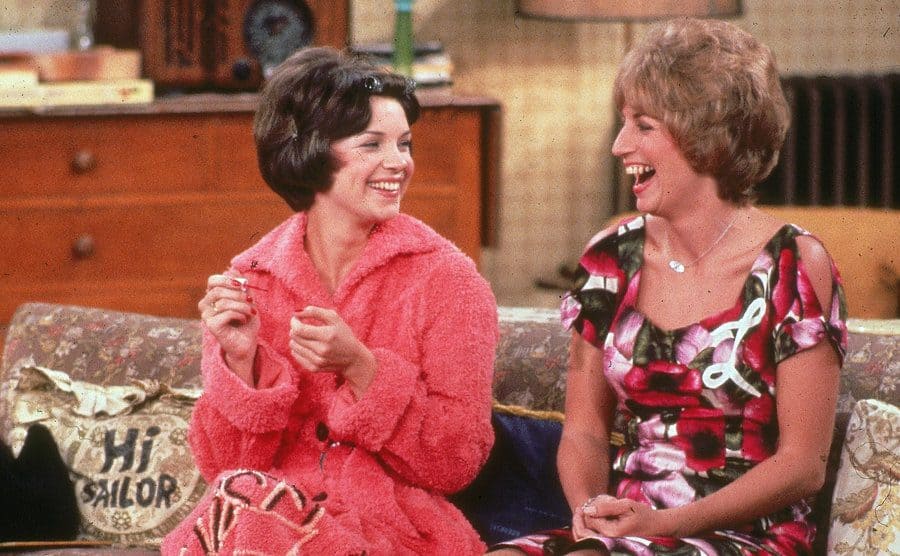 Laverne and Shirley sitting on the sofa 