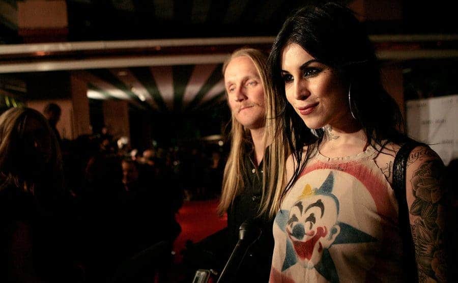 Kat Von D on the red carpet with Orbi in the background blurred out 