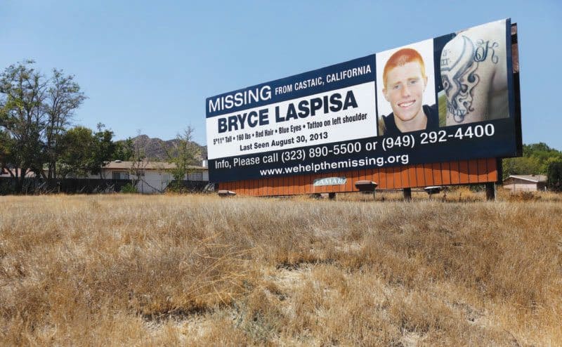A billboard with a missing poster for Bryce Laspisa. 