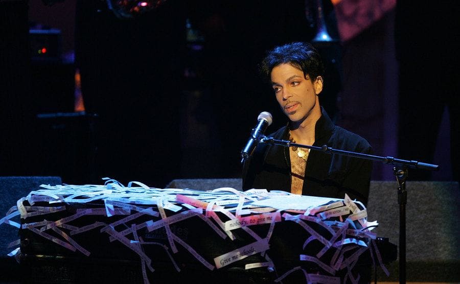 Prince performs with his piano on stage at the 36th NAACP Image Awards.
