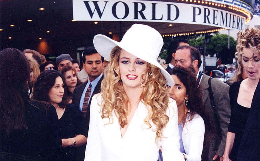 Alicia Silverstone dressed in a matching white suit and hat during 