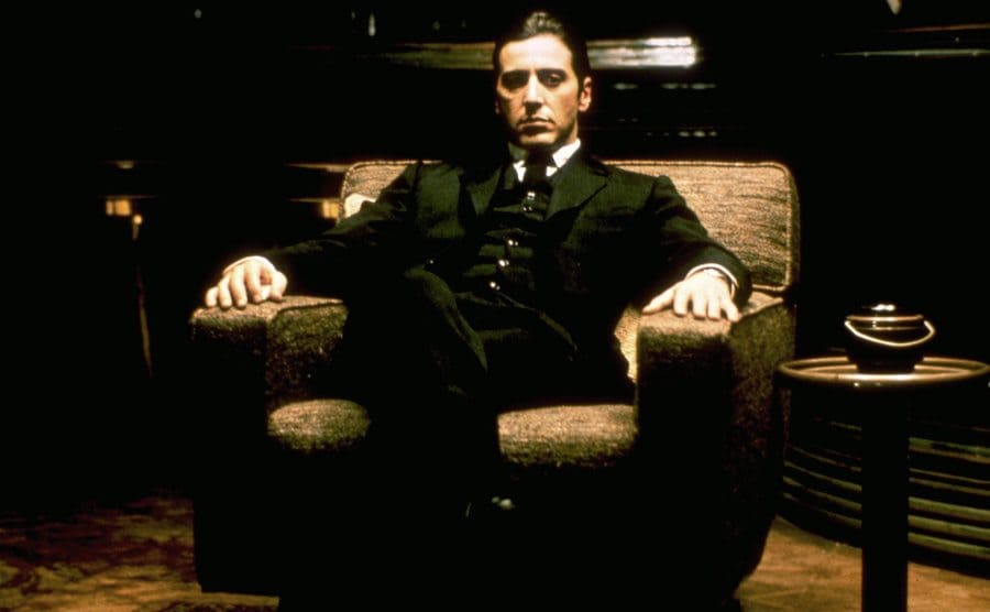 Al Pacino sits on his throne in a still from The Godfather.