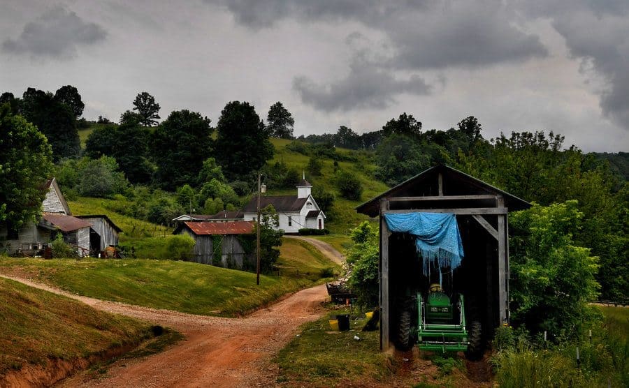 A farm and an old country church share a dirt road in the tiny hamlet of Sherman, West Virginia. 