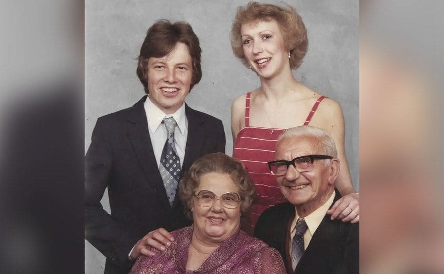 A family photo of Simon, his adopted sister, and his grandparents, Winifred and Ernest. 