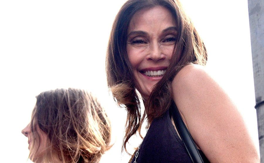 Teri Hatcher is giving a big smile to the camera.