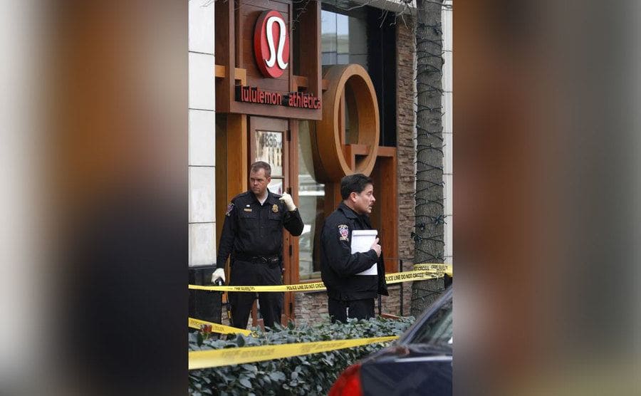 Police officers outside the Lululemon. 