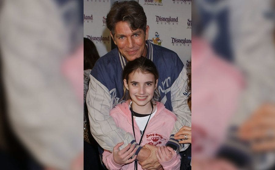 Eric Roberts embraces Emma at a movie premiere. 
