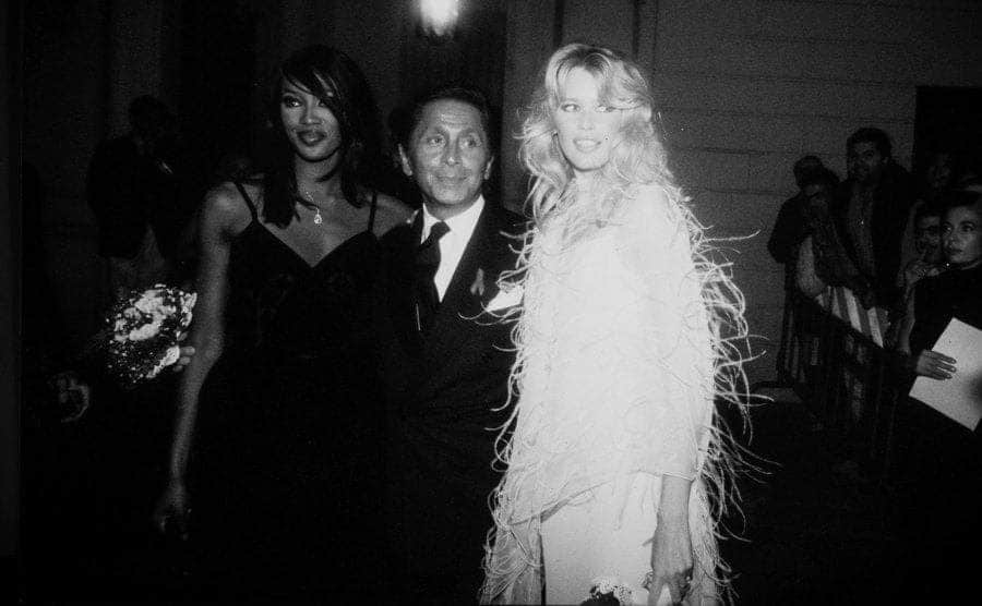 Naomi Campbell, Valentino, and Claudia Schiffer pose for the press in Valentino's new boutique celebration. 
