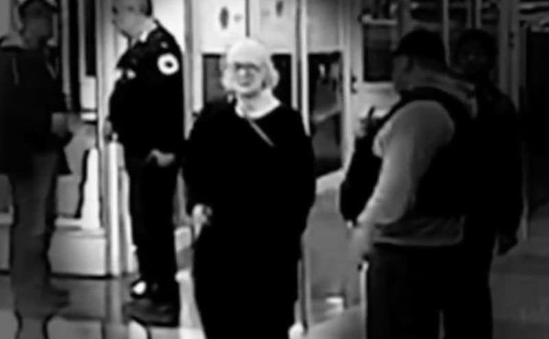 A footage still shows Marilyn trying to make her way through the airport. 
