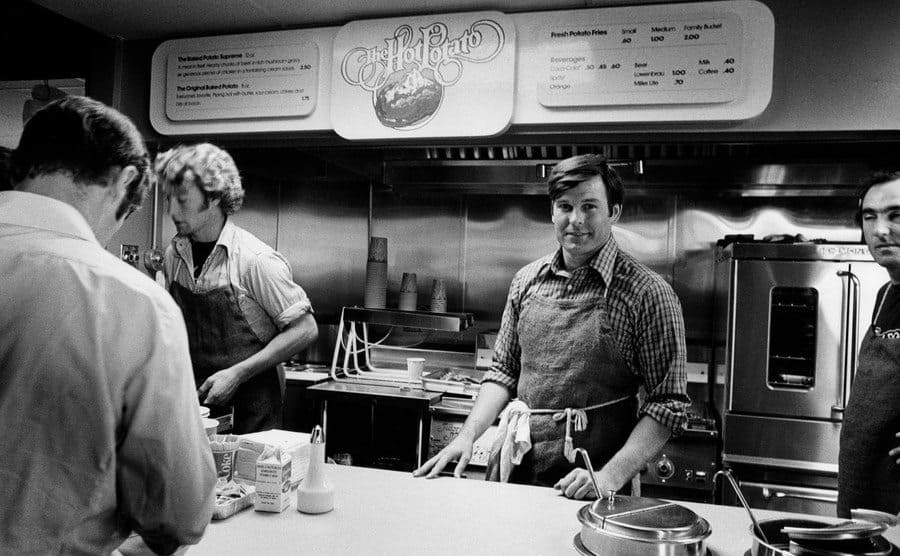 Dan White stands behind the counter of his fast-food restaurant.