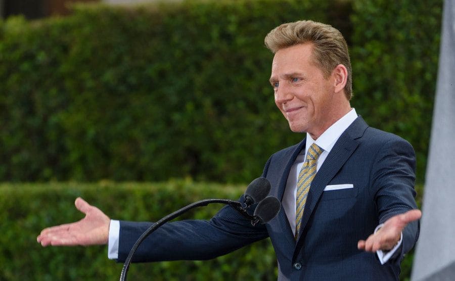 David Miscavige, chief of the Church of Scientology, talks onstage. 