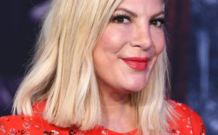 Tori Spelling arrives at a premiere event.