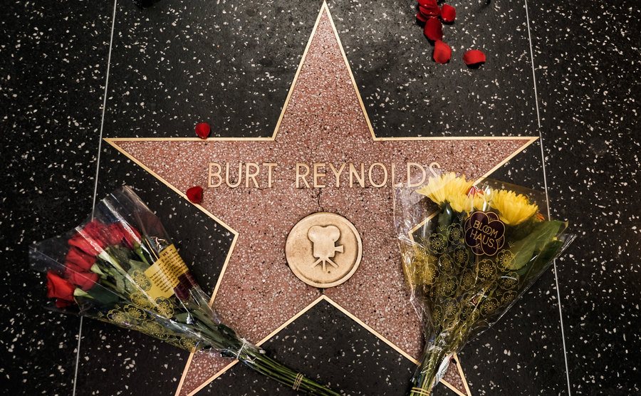 Flowers on Burt Reynolds’ Star on the Hollywood Walk of Fame. 