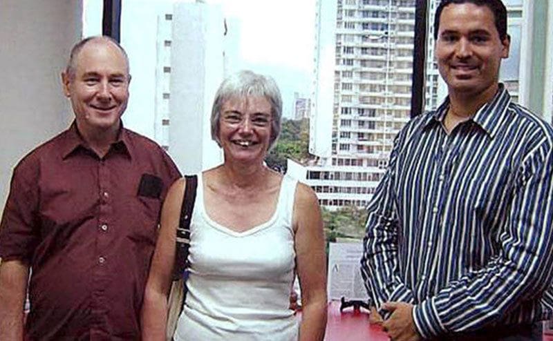 John and Anne pose for a picture with an estate agent in Panama.