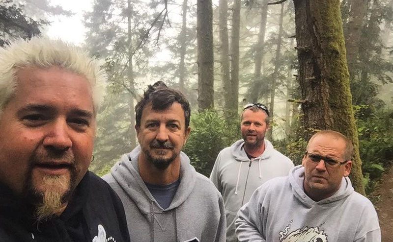 Guy Fieri takes a picture with his friends in his hometown. 