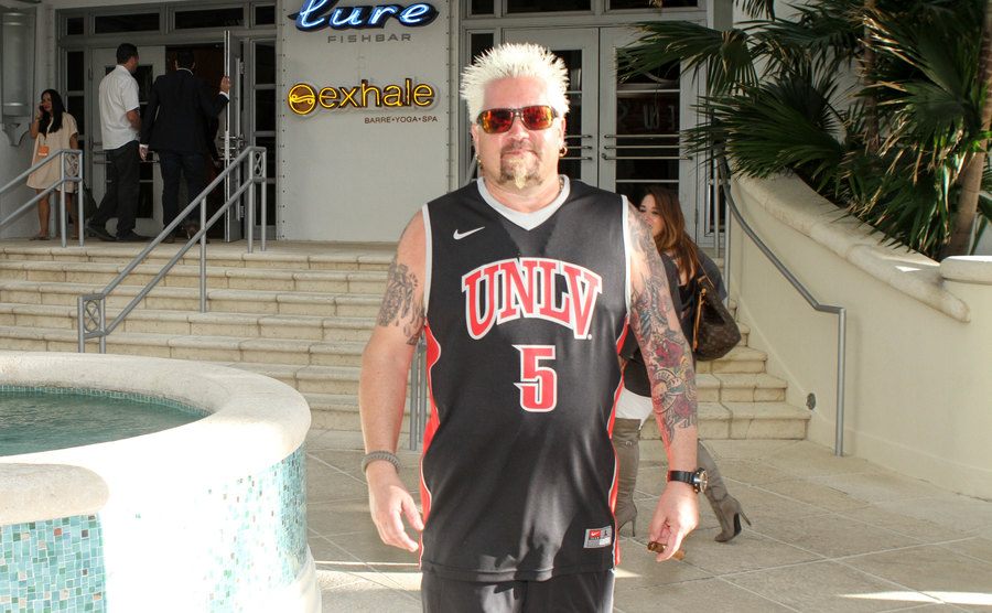 A picture of Guy Fieri during a food festival. 