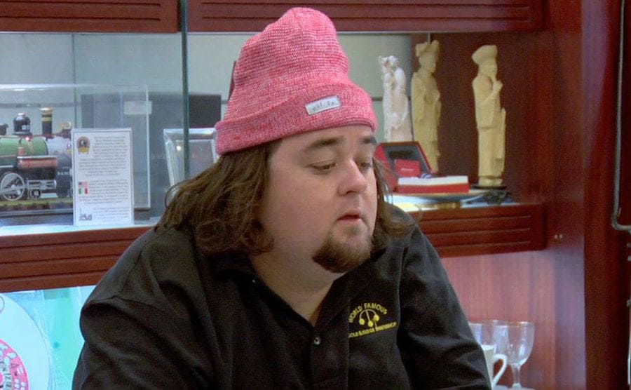 Chumlee stands behind the counter at the Gold and Silver Pawn Shop. 